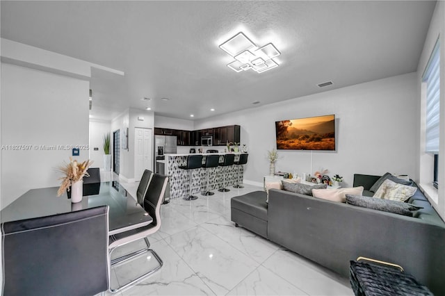 3574 W 88th Ter, Hialeah, FL 33018 - living area with light marble finish floors and recessed lighting