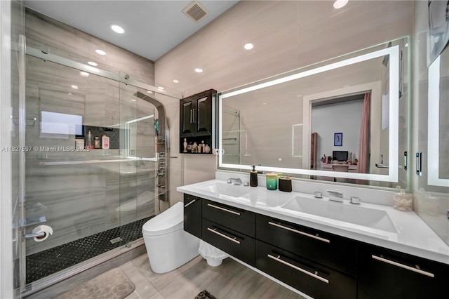 3574 W 88th Ter, Hialeah, FL 33018 - bathroom featuring double vanity, a shower stall, and recessed lighting