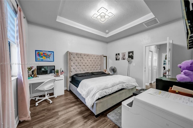 3574 W 88th Ter, Hialeah, FL 33018 - bedroom with a raised ceiling, wood finished floors, and a textured ceiling
