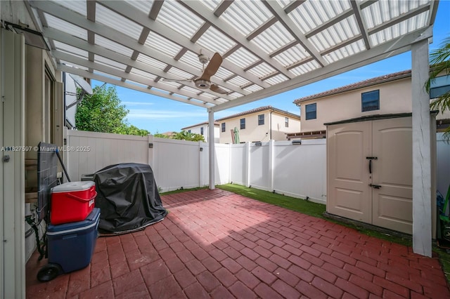 3574 W 88th Ter, Hialeah, FL 33018 - fenced backyard featuring a patio area, area for grilling, a pergola, and a storage shed