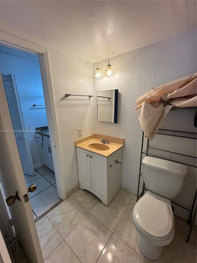 12105 NE 6th Ave Unit 304, North Miami, FL 33161 - half bathroom featuring vanity and marble finish floors
