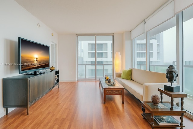 333 NE 24th St Unit 1401, Miami, FL 33137 - living room with light wood finished floors and baseboards