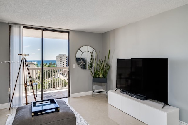 1500 S Ocean Dr Unit 7K, Hollywood, FL 33019 - living area featuring expansive windows and a textured ceiling