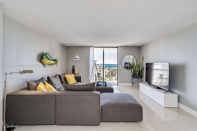 1500 S Ocean Dr Unit 7K, Hollywood, FL 33019 - living room with baseboards and light tile patterned floors