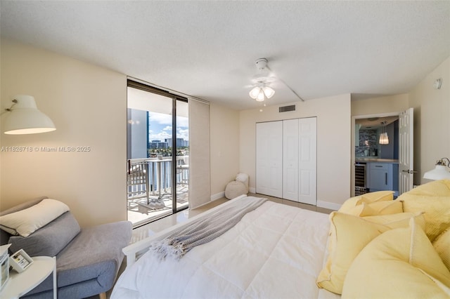 1500 S Ocean Dr Unit 7K, Hollywood, FL 33019 - bedroom with access to exterior, beverage cooler, floor to ceiling windows, a closet, and ceiling fan