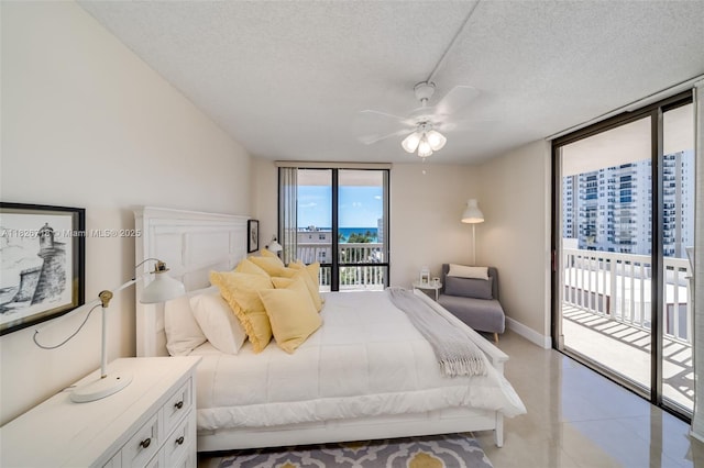 1500 S Ocean Dr Unit 7K, Hollywood, FL 33019 - bedroom with access to exterior, a textured ceiling, floor to ceiling windows, and ceiling fan
