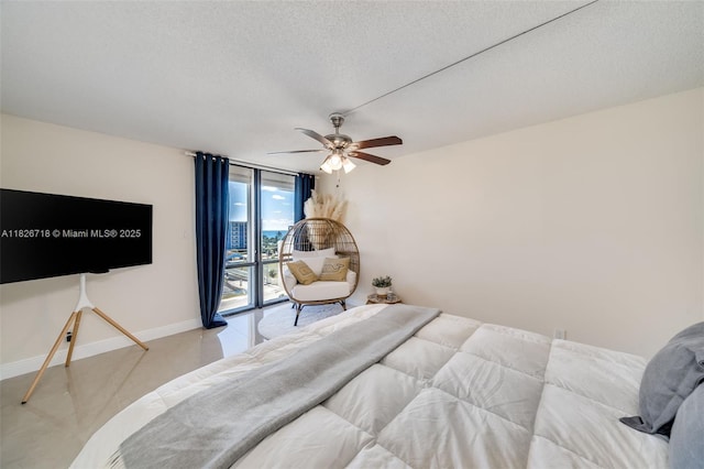 1500 S Ocean Dr Unit 7K, Hollywood, FL 33019 - bedroom with a wall of windows, access to outside, a textured ceiling, and ceiling fan