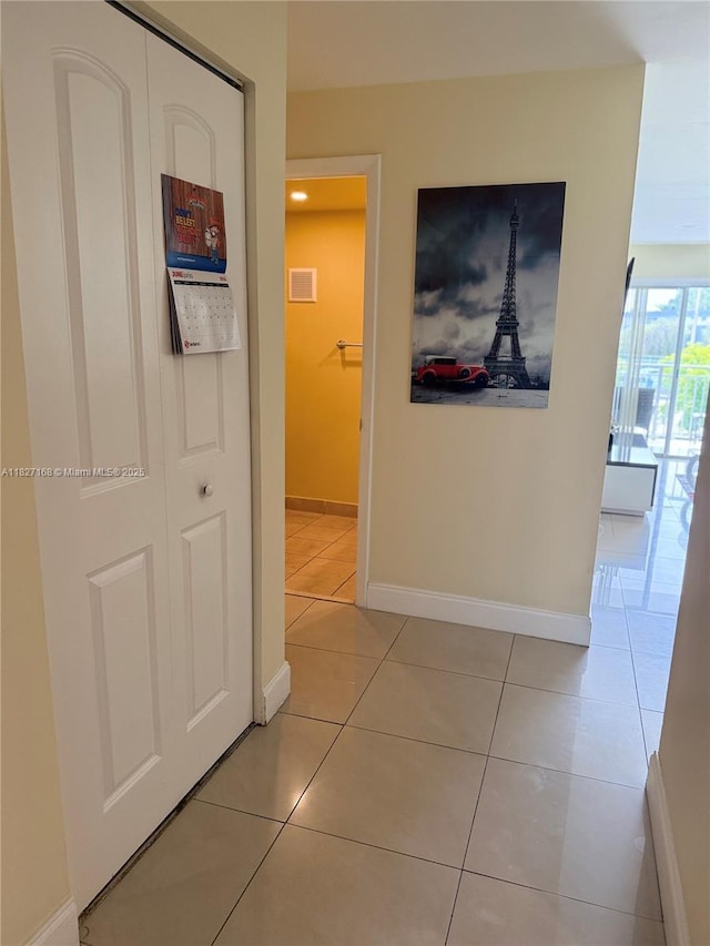9365 Fontainebleau, Miami, FL 33172 - hallway with light tile patterned floors and baseboards