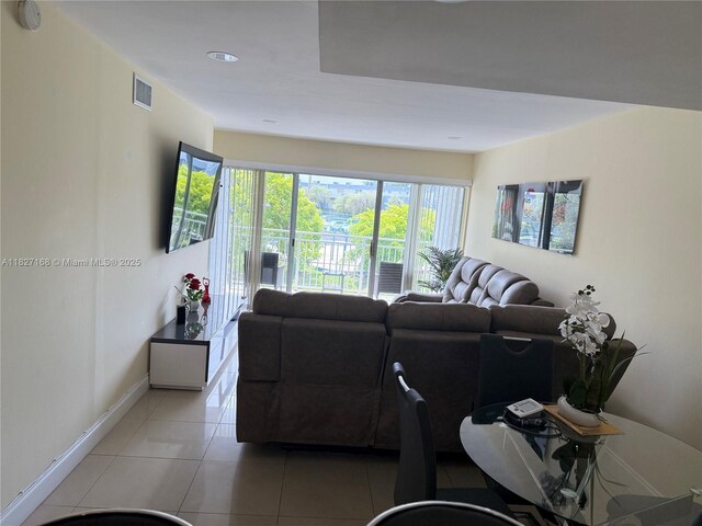 9365 Fontainebleau, Miami, FL 33172 - living area featuring light tile patterned floors and baseboards