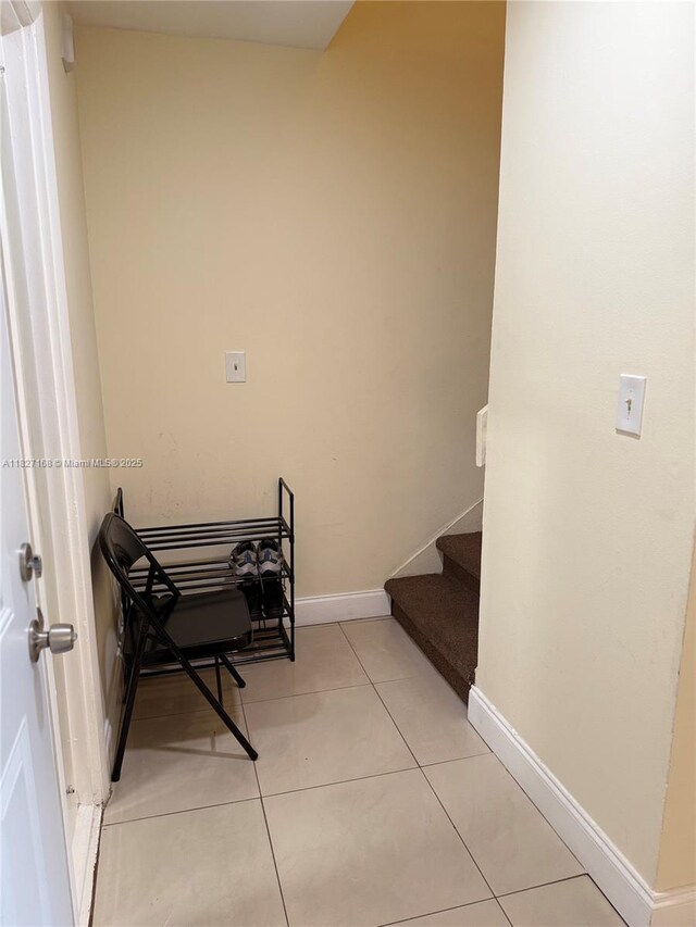 9365 Fontainebleau, Miami, FL 33172 - stairs with baseboards and tile patterned floors
