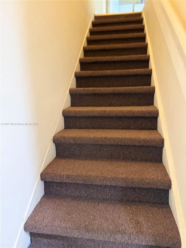 9365 Fontainebleau, Miami, FL 33172 - stairway with baseboards