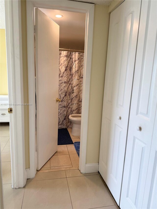 9365 Fontainebleau, Miami, FL 33172 - hall featuring light tile patterned flooring and recessed lighting
