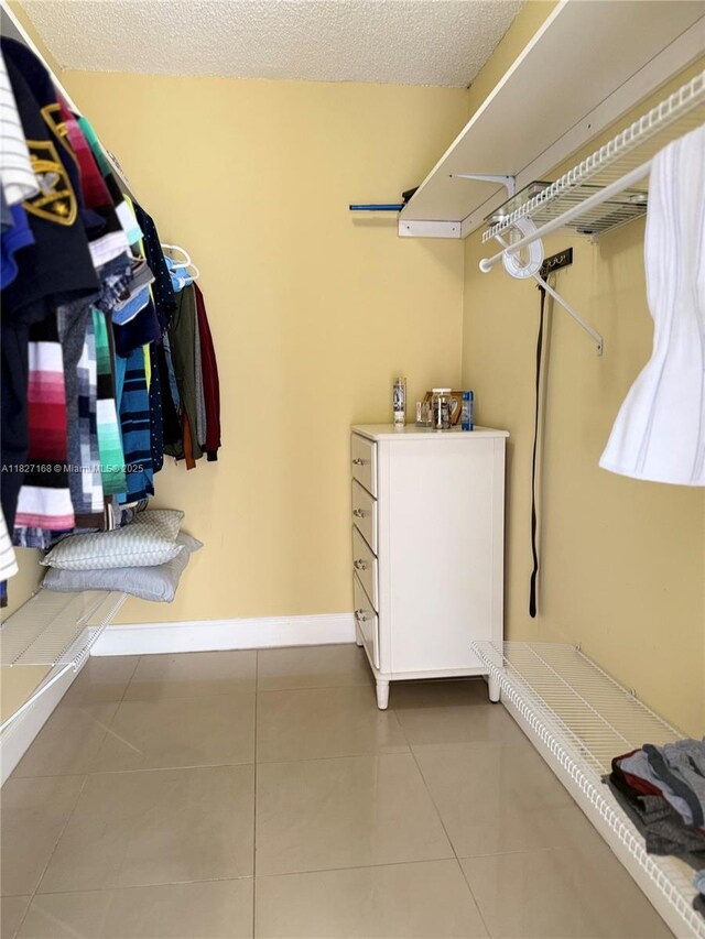 9365 Fontainebleau, Miami, FL 33172 - spacious closet featuring tile patterned floors
