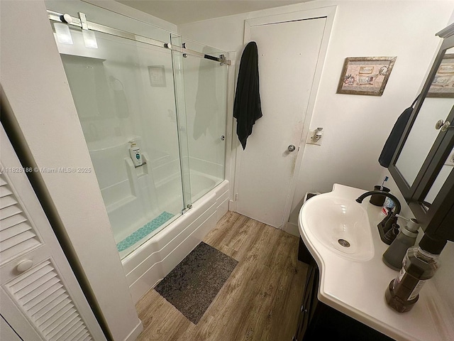 13499 Biscayne Blvd Unit 1013, North Miami, FL 33181 - bathroom featuring wood finished floors, vanity, and shower / bath combination with glass door