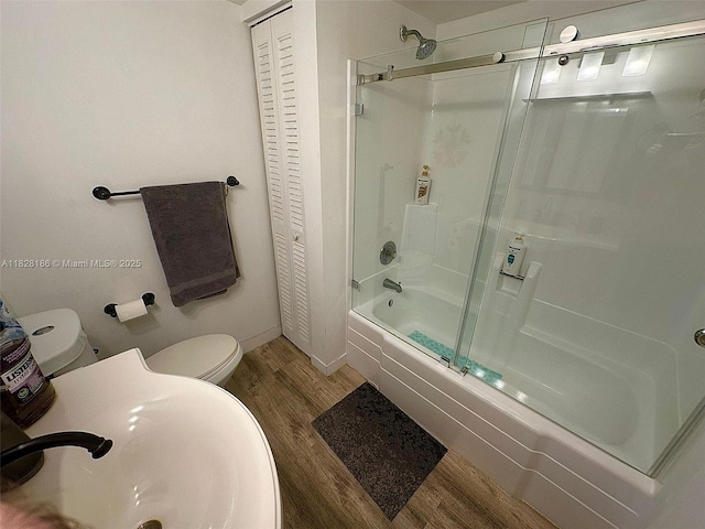 13499 Biscayne Blvd Unit 1013, North Miami, FL 33181 - full bathroom with a closet, wood finished floors, and bath / shower combo with glass door