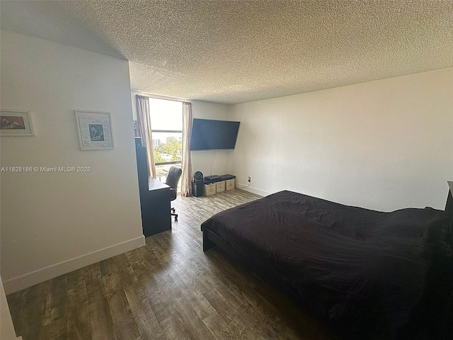 13499 Biscayne Blvd Unit 1013, North Miami, FL 33181 - bedroom with wood finished floors and a textured ceiling