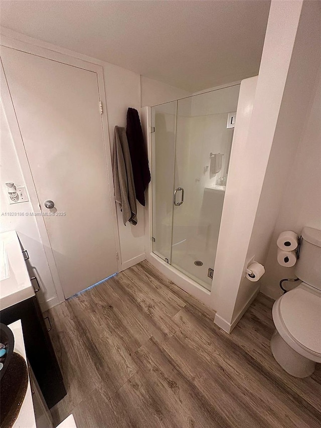 13499 Biscayne Blvd Unit 1013, North Miami, FL 33181 - bathroom with wood finished floors, a shower stall, and vanity