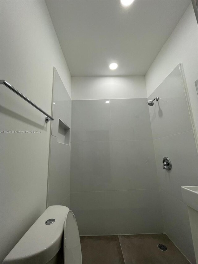126 Mendoza Ave Unit 1, Coral Gables, FL 33134 - full bathroom featuring tiled shower and tile patterned flooring