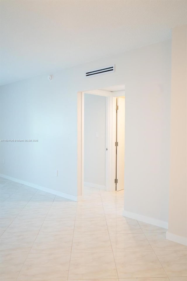 400 Kings Point Dr Unit 1222, Sunny Isles Beach, FL 33160 - unfurnished room with baseboards and light tile patterned flooring