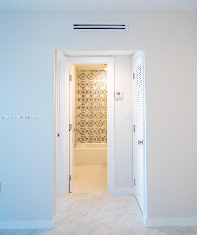 400 Kings Point Dr Unit 1222, Sunny Isles Beach, FL 33160 - hallway featuring baseboards and light tile patterned floors