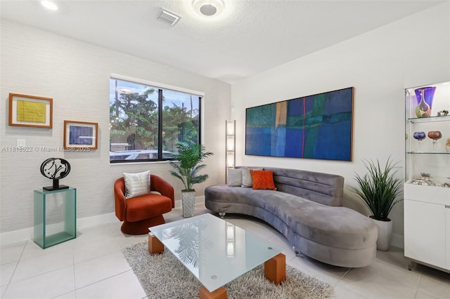 8001 NW 41st St Unit F-112, Doral, FL 33166 - living area featuring tile patterned flooring and a textured ceiling