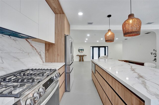 5850 Rose Ter, Plantation, FL 33317 - kitchen featuring stainless steel appliances, modern cabinets, tasteful backsplash, light stone countertops, and recessed lighting