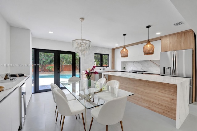 5850 Rose Ter, Plantation, FL 33317 - dining room featuring recessed lighting, a chandelier, and french doors