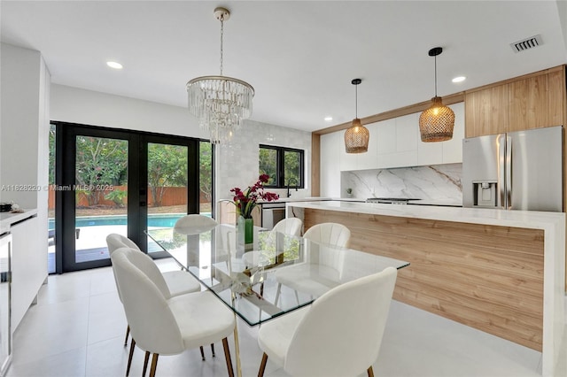 5850 Rose Ter, Plantation, FL 33317 - dining space featuring french doors, recessed lighting, a chandelier, and light tile patterned floors