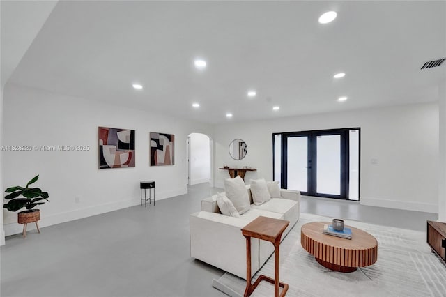 5850 Rose Ter, Plantation, FL 33317 - living room featuring arched walkways, recessed lighting, and concrete flooring