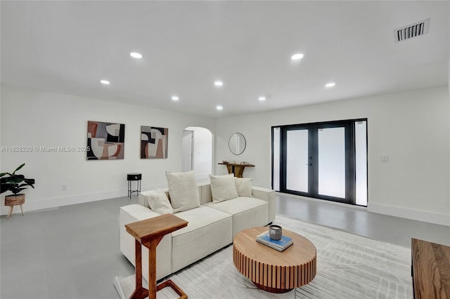 5850 Rose Ter, Plantation, FL 33317 - living area with arched walkways, recessed lighting, and french doors
