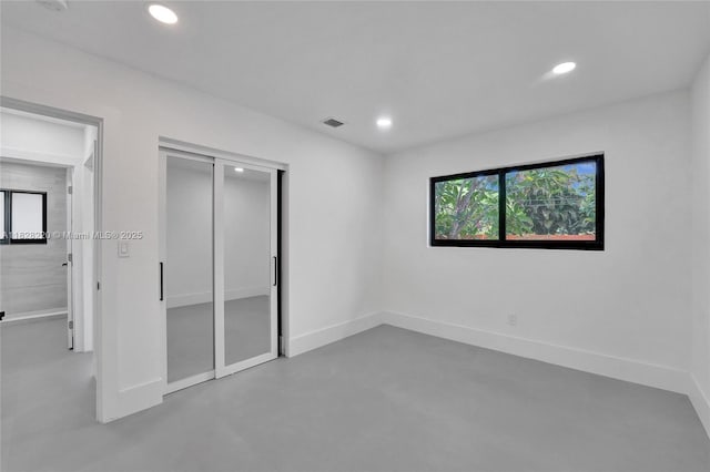 5850 Rose Ter, Plantation, FL 33317 - unfurnished bedroom featuring recessed lighting, finished concrete flooring, and a closet
