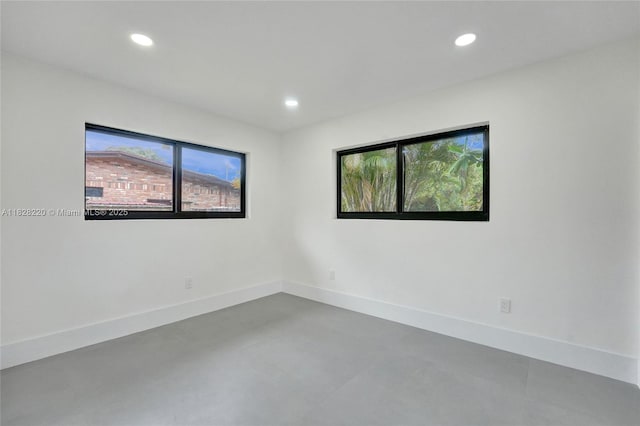 5850 Rose Ter, Plantation, FL 33317 - empty room with healthy amount of natural light, recessed lighting, and concrete floors
