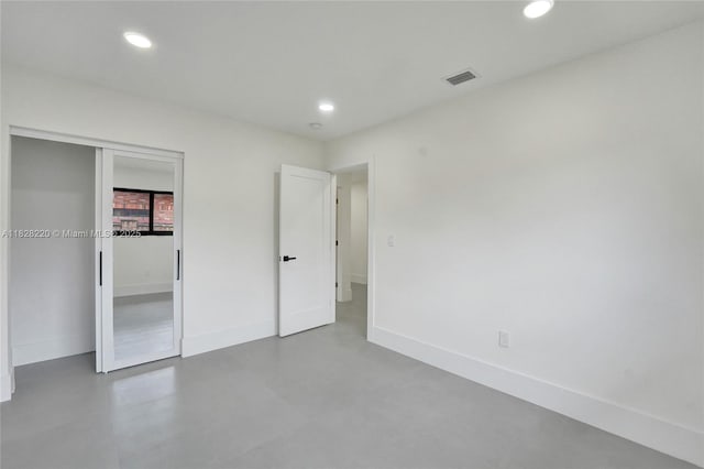 5850 Rose Ter, Plantation, FL 33317 - unfurnished bedroom with recessed lighting, concrete flooring, and a closet