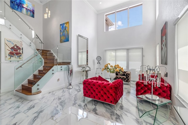 16488 SW 30th St, Miramar, FL 33027 - living area with a towering ceiling, stairway, crown molding, marble tiled flooring, and healthy amount of natural light