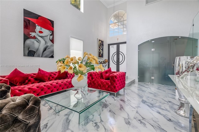 16488 SW 30th St, Miramar, FL 33027 - living area featuring ornamental molding, marble finish flooring, a towering ceiling, french doors, and arched walkways