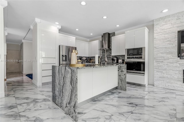 16488 SW 30th St, Miramar, FL 33027 - kitchen featuring crown molding, stainless steel appliances, modern cabinets, white cabinetry, and dark stone countertops