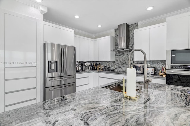 16488 SW 30th St, Miramar, FL 33027 - kitchen with appliances with stainless steel finishes, wall chimney exhaust hood, light stone countertops, ornamental molding, and tasteful backsplash