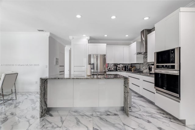 16488 SW 30th St, Miramar, FL 33027 - kitchen featuring stainless steel appliances, wall chimney range hood, ornamental molding, recessed lighting, and dark stone countertops