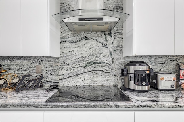 16488 SW 30th St, Miramar, FL 33027 - kitchen with backsplash, white cabinetry, exhaust hood, and light stone countertops