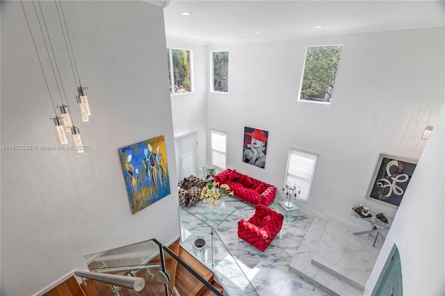16488 SW 30th St, Miramar, FL 33027 - living area with marble finish flooring, plenty of natural light, recessed lighting, a towering ceiling, and ornamental molding