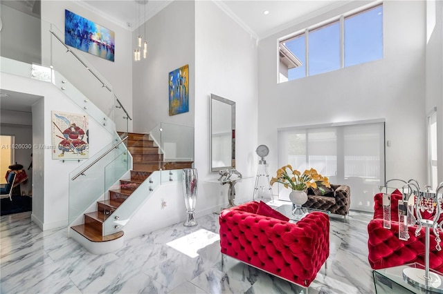 16488 SW 30th St, Miramar, FL 33027 - living room with a towering ceiling, stairs, marble finish floors, ornamental molding, and healthy amount of natural light