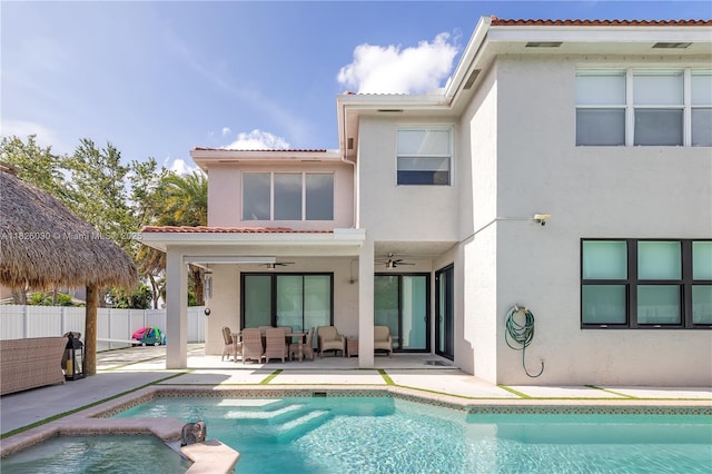 16488 SW 30th St, Miramar, FL 33027 - back of house with stucco siding, a ceiling fan, an outdoor living space, and a patio