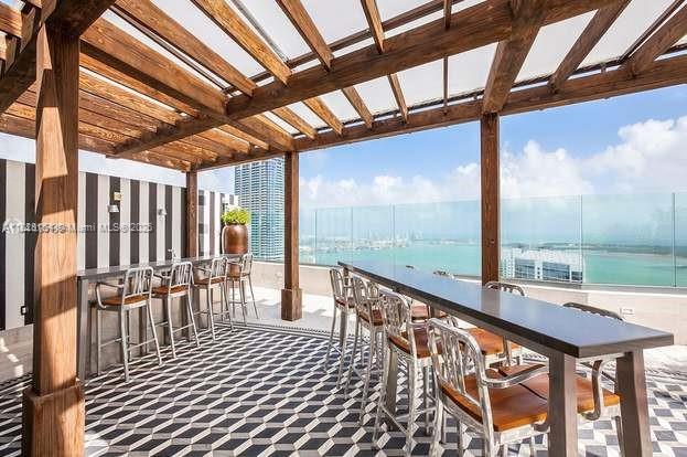 88 SW 7th St Unit 3006, Miami, FL 33130 - balcony with a water view and a pergola