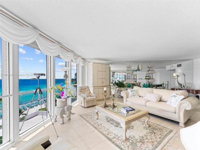 16445 Collins Ave Unit 726, Sunny Isles Beach, FL 33160 - living room featuring a water view, a textured ceiling, and tile patterned floors