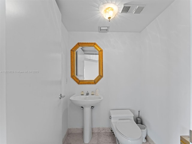 16445 Collins Ave Unit 726, Sunny Isles Beach, FL 33160 - bathroom featuring toilet and baseboards