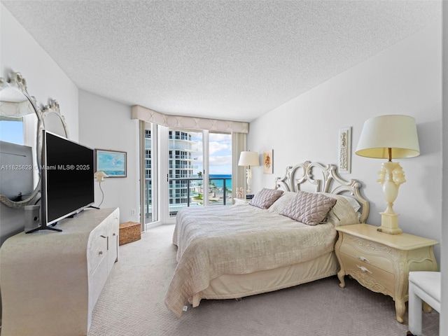 16445 Collins Ave Unit 726, Sunny Isles Beach, FL 33160 - bedroom featuring carpet flooring, access to exterior, and a textured ceiling
