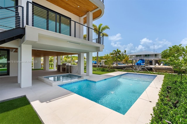 301 Buttonwood Cir # B, Key Largo, FL 33037 - view of swimming pool featuring area for grilling, a patio area, and a pool with connected hot tub