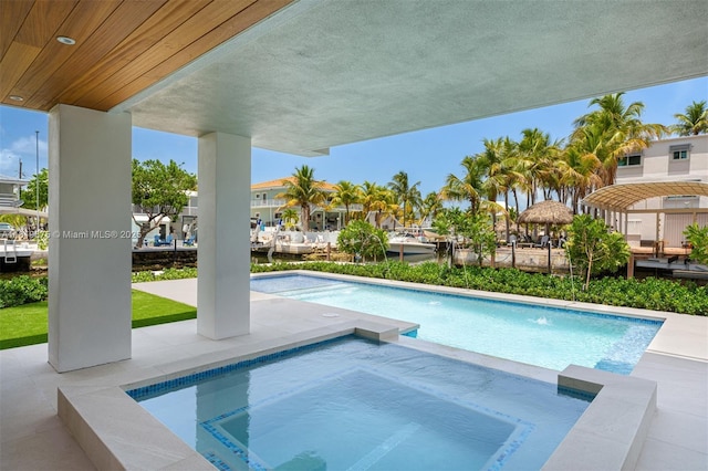301 Buttonwood Cir # B, Key Largo, FL 33037 - outdoor pool featuring an in-ground hot tub and a patio area