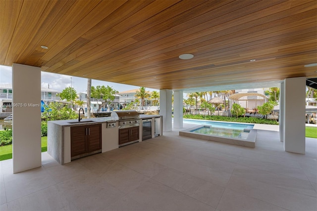 301 Buttonwood Cir # B, Key Largo, FL 33037 - view of patio featuring exterior kitchen, an outdoor pool, and beverage cooler