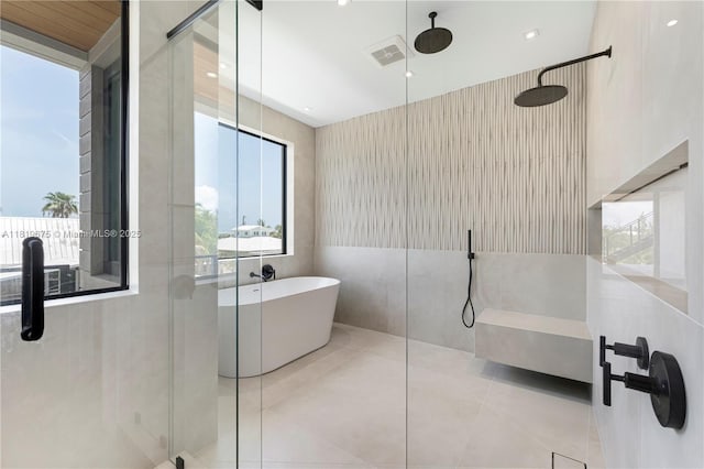 301 Buttonwood Cir # B, Key Largo, FL 33037 - full bathroom with a walk in shower, a freestanding tub, and tile patterned flooring